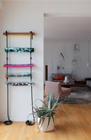 Decorative rope ladder on wall of modern living room 