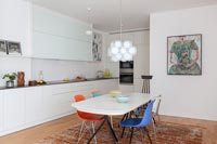 Contemporary dining area in white kitchen-diner 