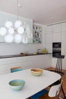 Contemporary dining area in white kitchen-diner 