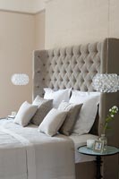 Large upholstered headboard in classic style modern bedroom 