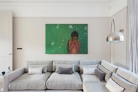 Colourful artwork on wall of neutral modern living room 