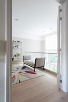 View through open internal doors to modern mezzanine living room 