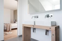 Double sinks in modern en-suite bathroom 