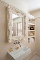 Decorative mirror above sink 