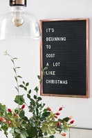 Humorous sign on wall during Christmas 