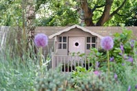 Decorative playhouse in modern garden 
