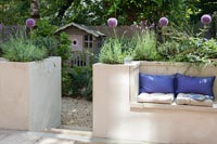 Built-in bench seating in modern courtyard garden 