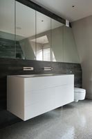 Contemporary sink unit in modern bathroom 