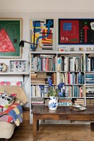 Bookshelves in colourful modern living room