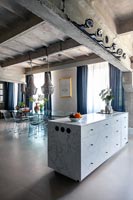 Modern kitchen-diner in industrial open plan living space 