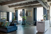 Modern kitchen-diner in industrial open plan living space 
