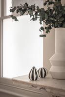 Vase and ornaments on marble fireplace 