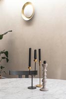 Candlesticks on marble dining table 