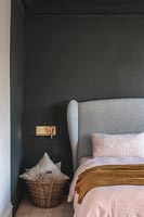 Modern bedroom with black painted wall