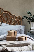 Gifts wrapped in brown boxes in modern bedroom 