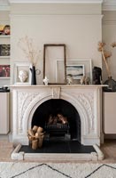 Detail of fireplace in neutrally decorated room 