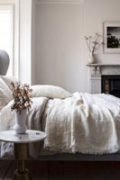 Cotton linen bedding on bed in modern country style bedroom 