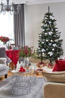 Modern living room dining area decorated for Christmas 