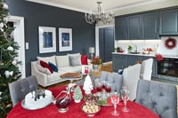 Grey painted open plan living space decorated for Christmas 