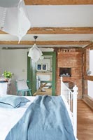 Country bedroom with blue and green accessories 