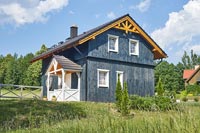 Exterior of blue wooden farmhouse 