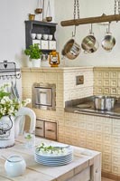Country kitchen with traditional tiled oven
