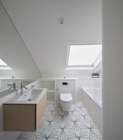 Modern bathroom with patterned flooring 