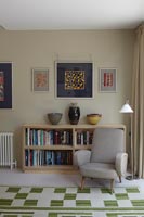 Small armchair and bookshelves in modern living room 