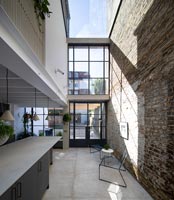 Narrow contemporary kitchen with glass ceiling - extension 