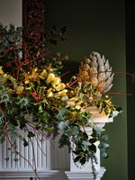 Detail of garland on mantelpiece at Christmas time 