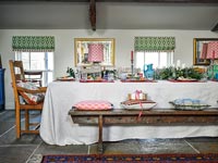 Dining table decorated for Christmas in country dining room 