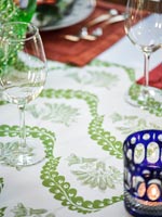 Detail of patterned tablecloth on dining room table 