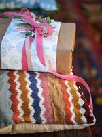 Christmas gift on patterned cushion 