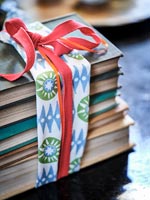Stack of books tied up with a fabric ribbon 