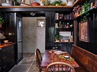 Small black painted country kitchen-diner 