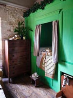 Green painted wooden alcove bed 