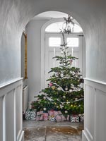 Christmas tree at end of hallway