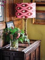 Lamp and flowers on sidetable 