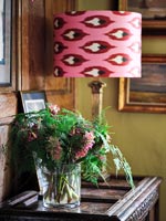 Lamp and flowers on sidetable 