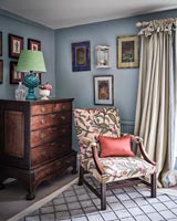 Armchair in corner of bedroom
