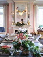 Modern country dining room laid for Christmas dinner 
