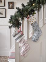 Stairs with Christmas garland and stockings