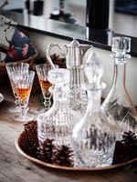 Glass decanters on sideboard