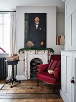 Country armchair with portrait painting 