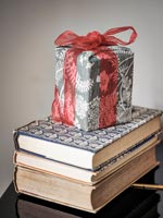 Christmas gift on stack of books 