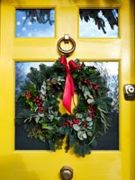 Country house door decorated for Christmas 
