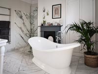 Classic style monochrome bathroom with decorative marble tiling 