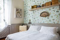 Patterned wallpaper in country bedroom 