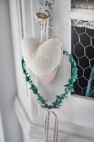 Heart shaped ornaments on cabinet door handle
