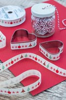 Metal cookie cutter covered with fabric ribbon on the outside edge